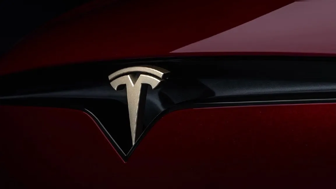 Gold Tesla T badge