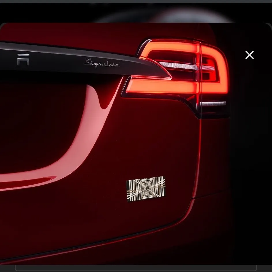 Signature liftgate applique and a gold plaid badge. 
